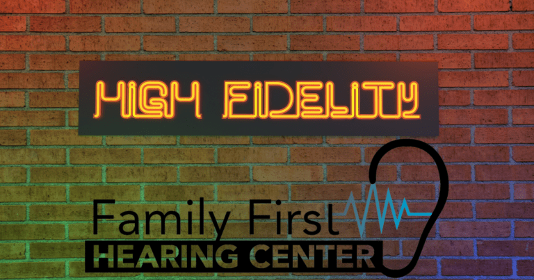 a brick wall with a neon sign that says high fidelity