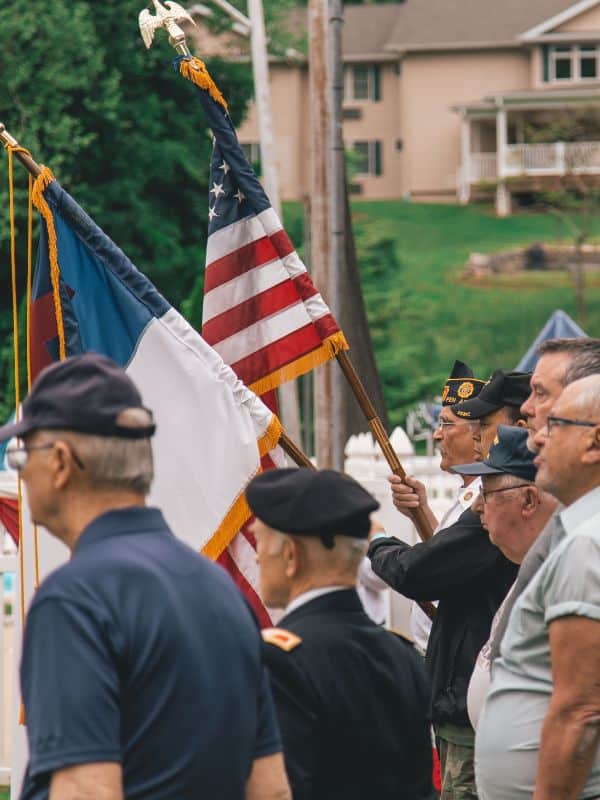 veterans honoring a flag raising